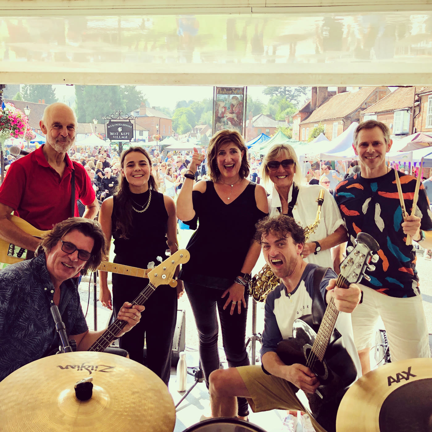 The Dirty Mavis band together at an outdoor summer festival